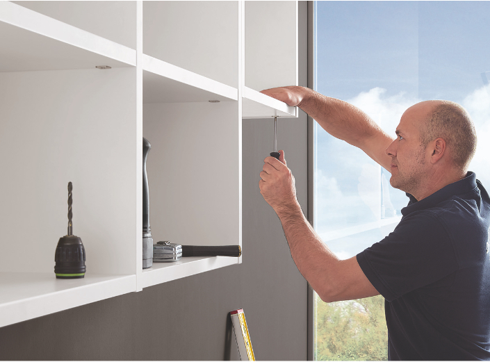 nobilia employee installing cabinetry